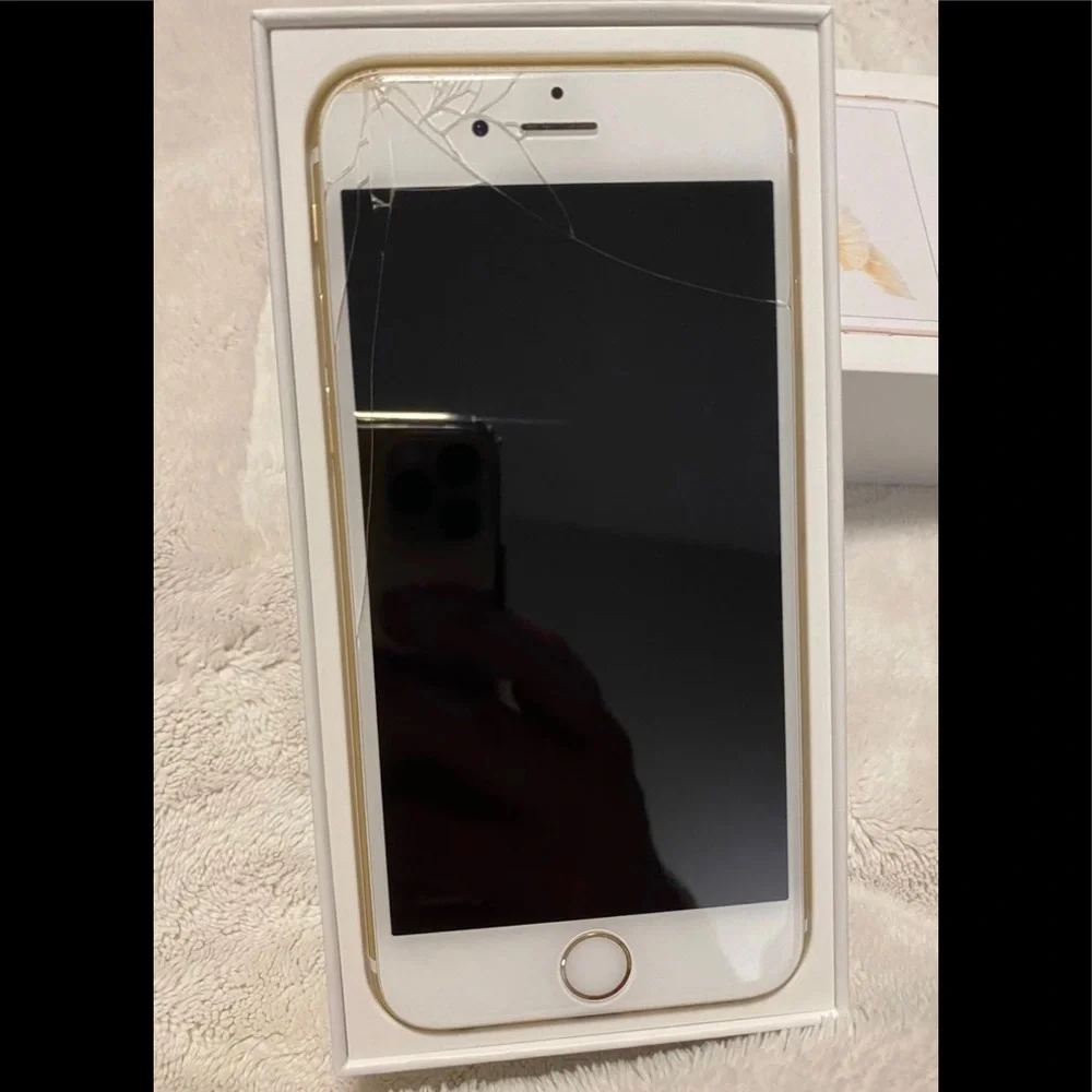 Apple iPhone 6s 32GB gold tone cell phone. Has cracked screen but still works.